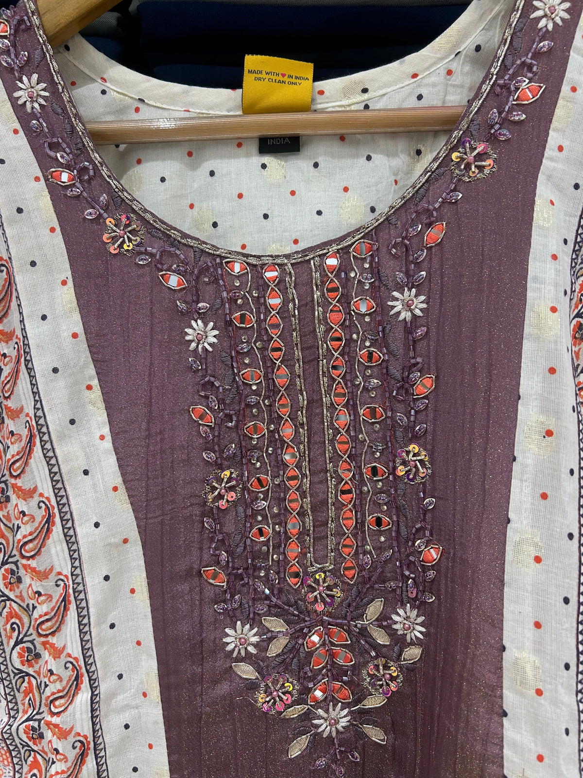 Close-up of intricate mirror work and floral embroidery on the yoke of the Mauve Bloom kurta