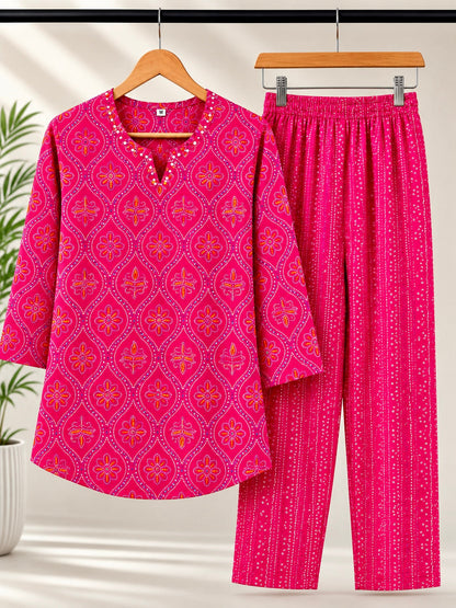 Rani pink bandhani coord set on hanger showing kurti and pants together