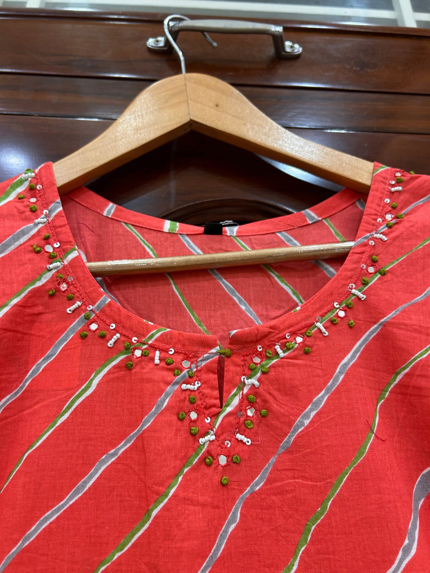 Coral Leheriya Kurti with Hand-Embellished Neckline