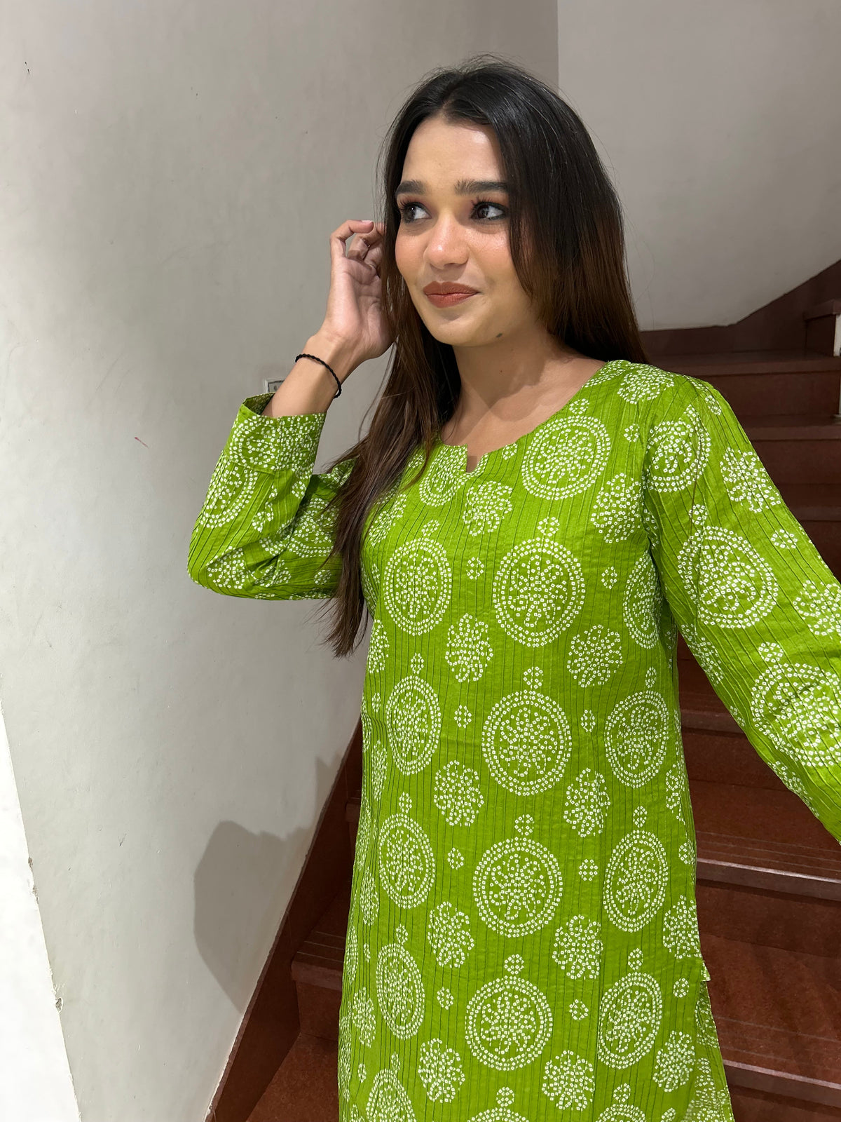 Model wearing green bandhani print cotton kurti full length