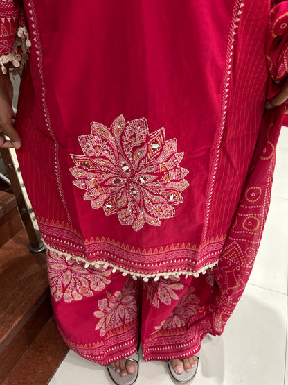 Close-up of embellished V-neckline on fuchsia kurta