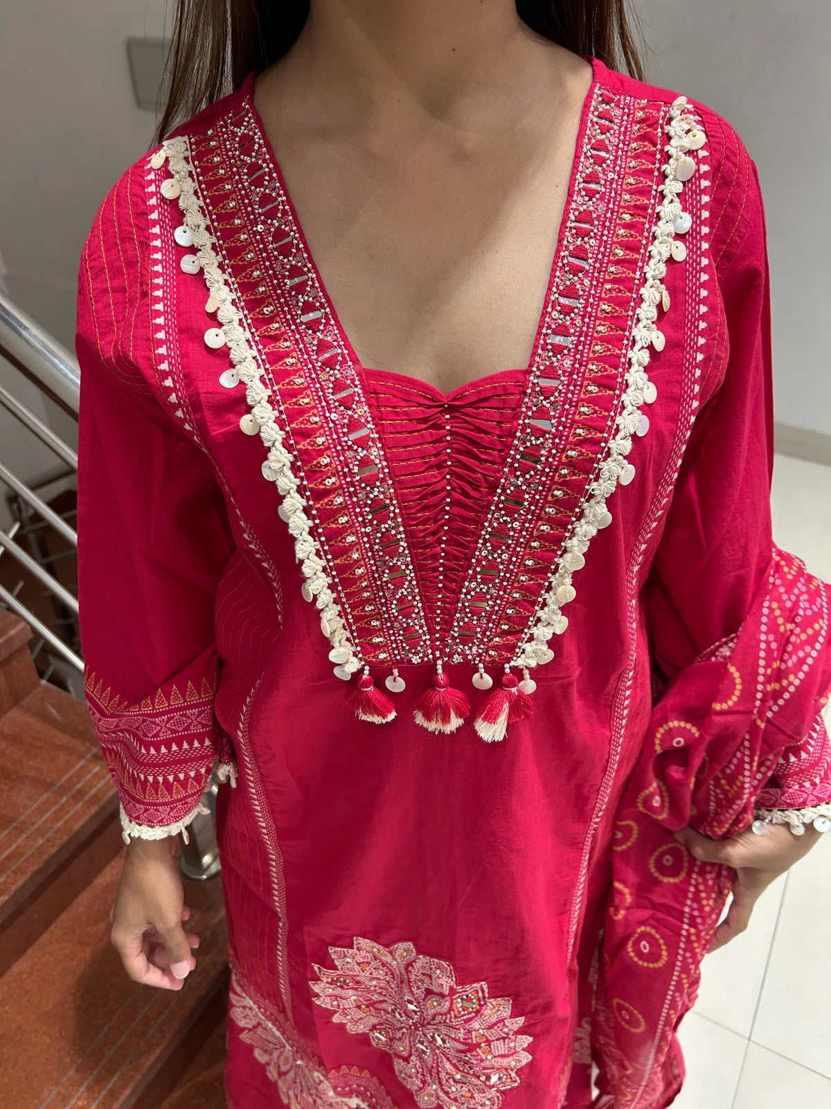 Full view of fuchsia kurta set with printed dupatta